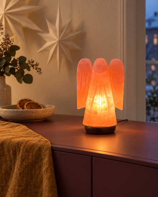 Angel Himalayan salt lamp glowing in a warm festive interior