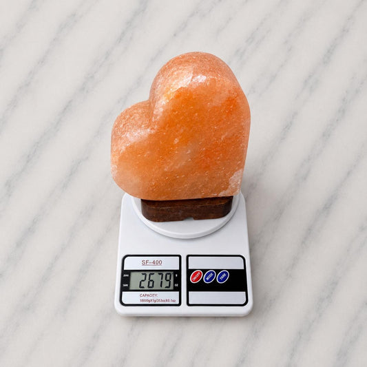 Heart Himalayan Pink Salt Lamp glowing warm pink light in home setting