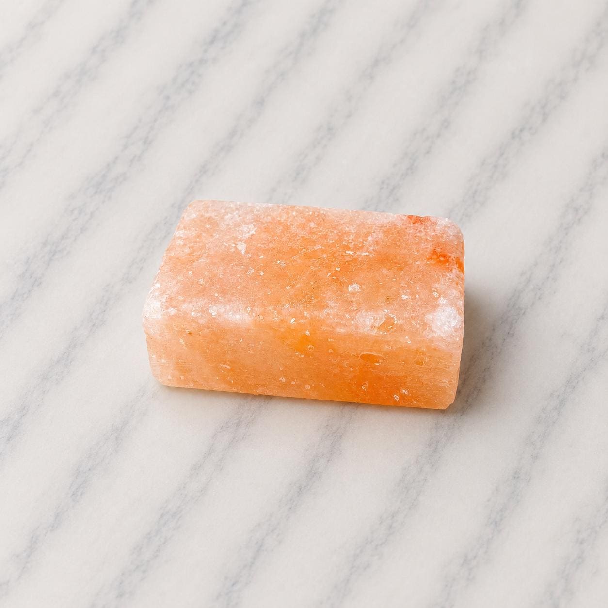 Himalayan Salt Massage Stone Square pink polished surface close up