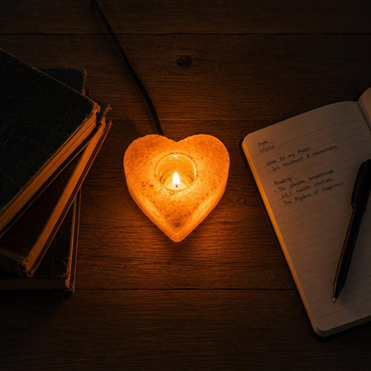 Himalayan Salt Candle Holder Heart shape glowing with warm candlelight