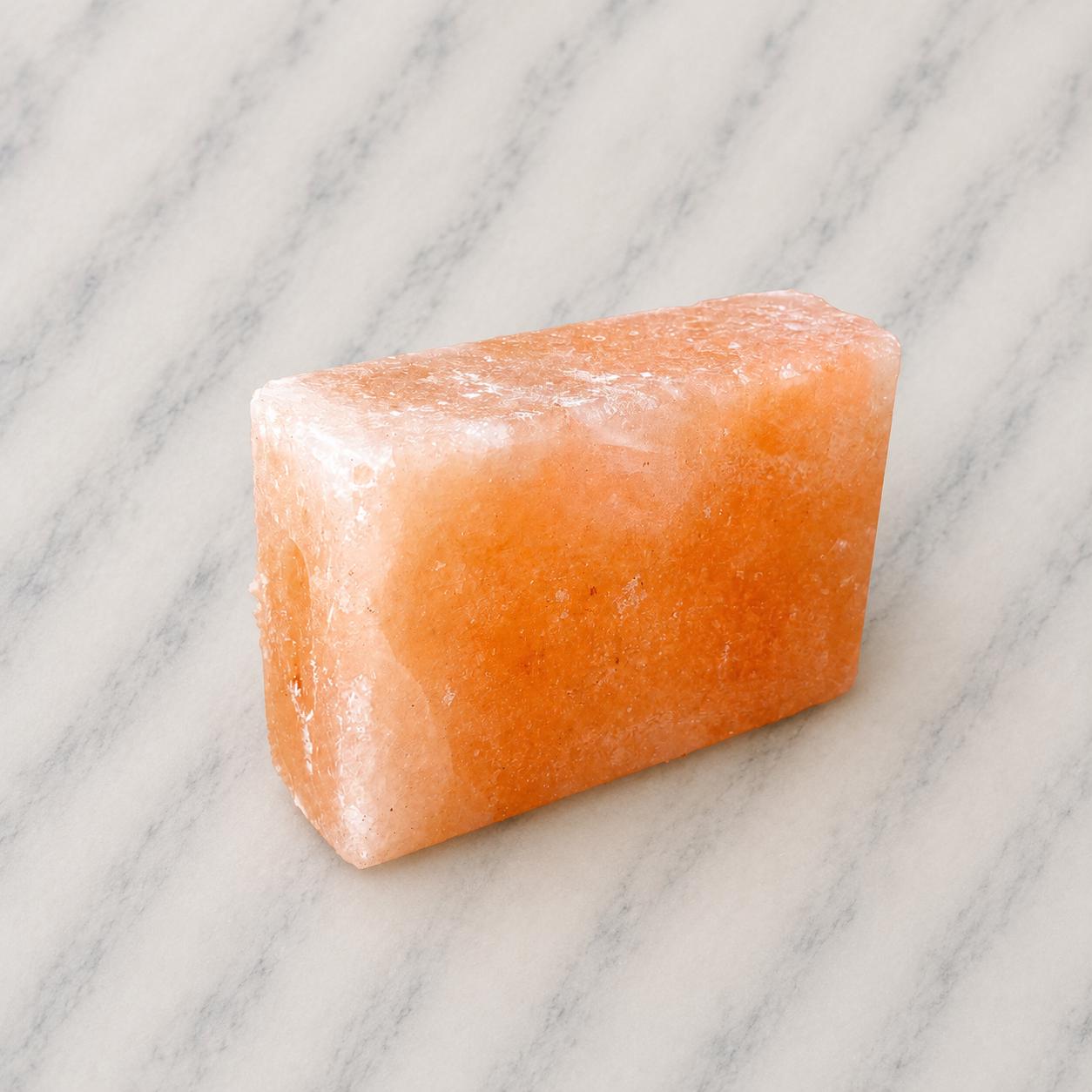 Himalayan Salt Massage Stone Square pink polished surface close up