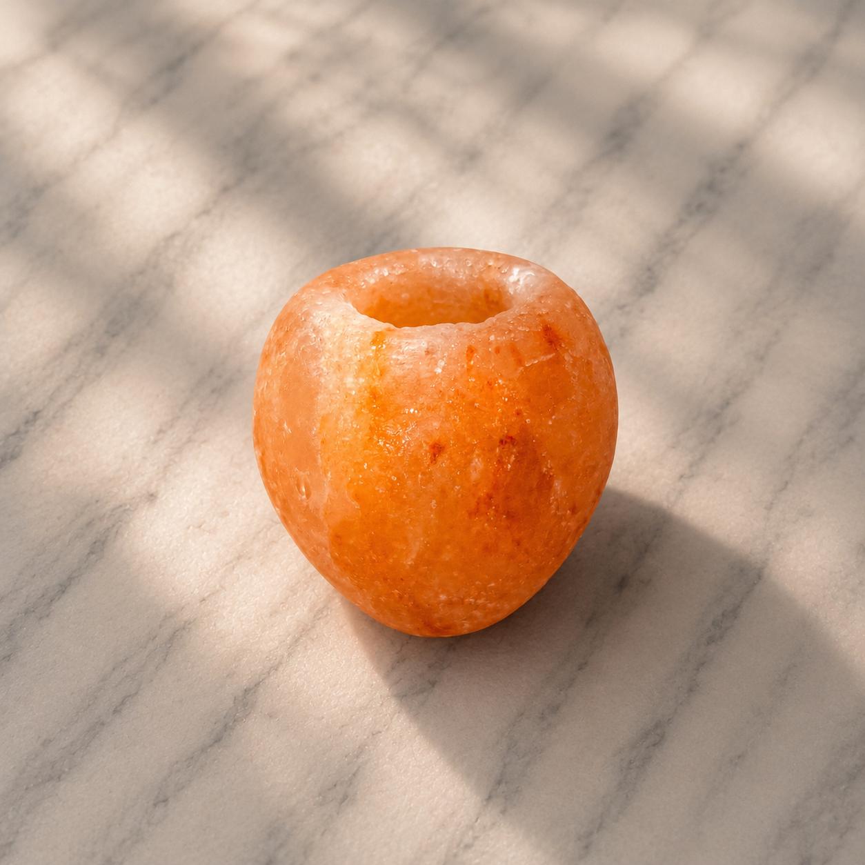 Himalayan Salt Candle Holder Apple shape glowing with warm candlelight
