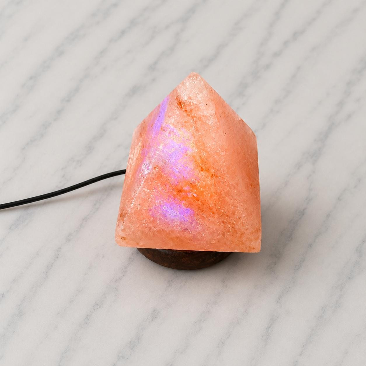 Mini Pyramid Himalayan Salt Lamp USB glowing pink on a desk
