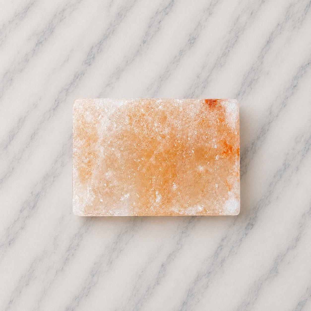 Himalayan Salt Massage Stone Square pink polished surface close up