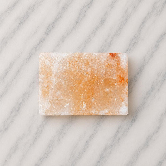 Himalayan Salt Massage Stone Square pink polished surface close up
