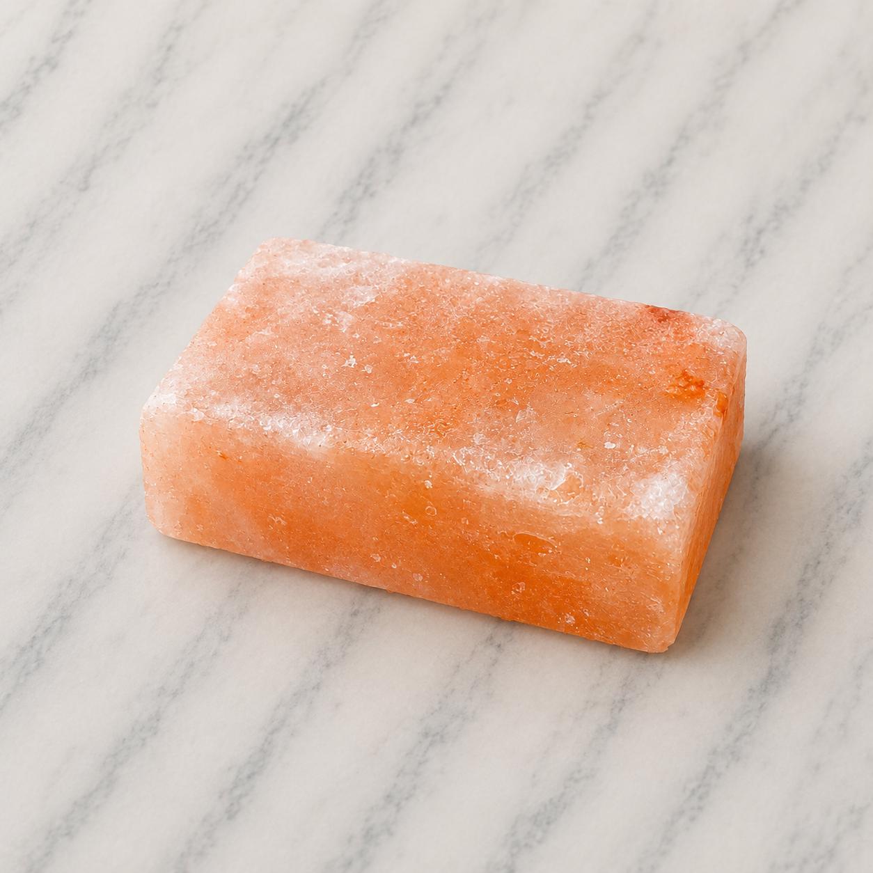 Himalayan Salt Massage Stone Square pink polished surface close up