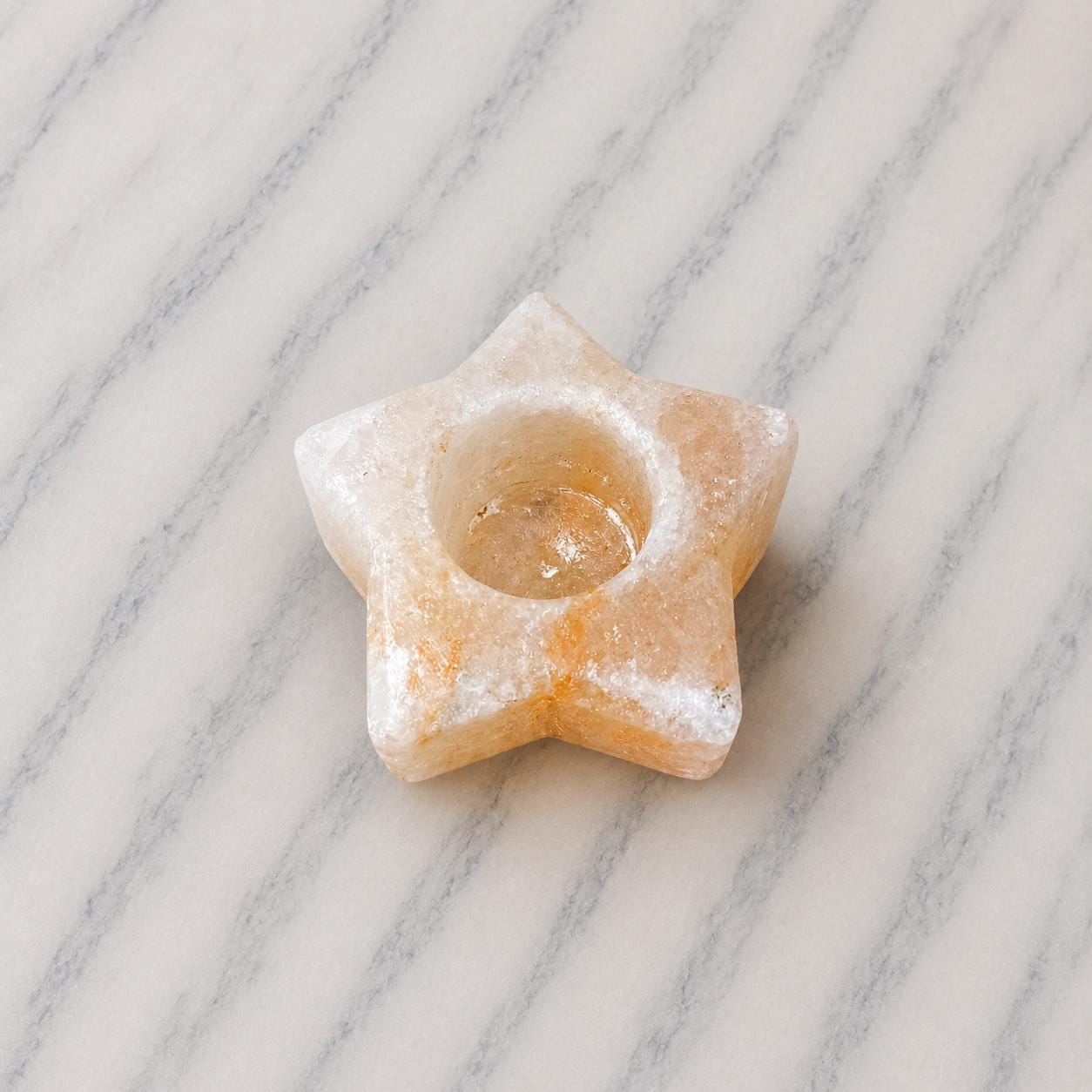 Himalayan Salt Candle Holder Star shape glowing with warm candlelight