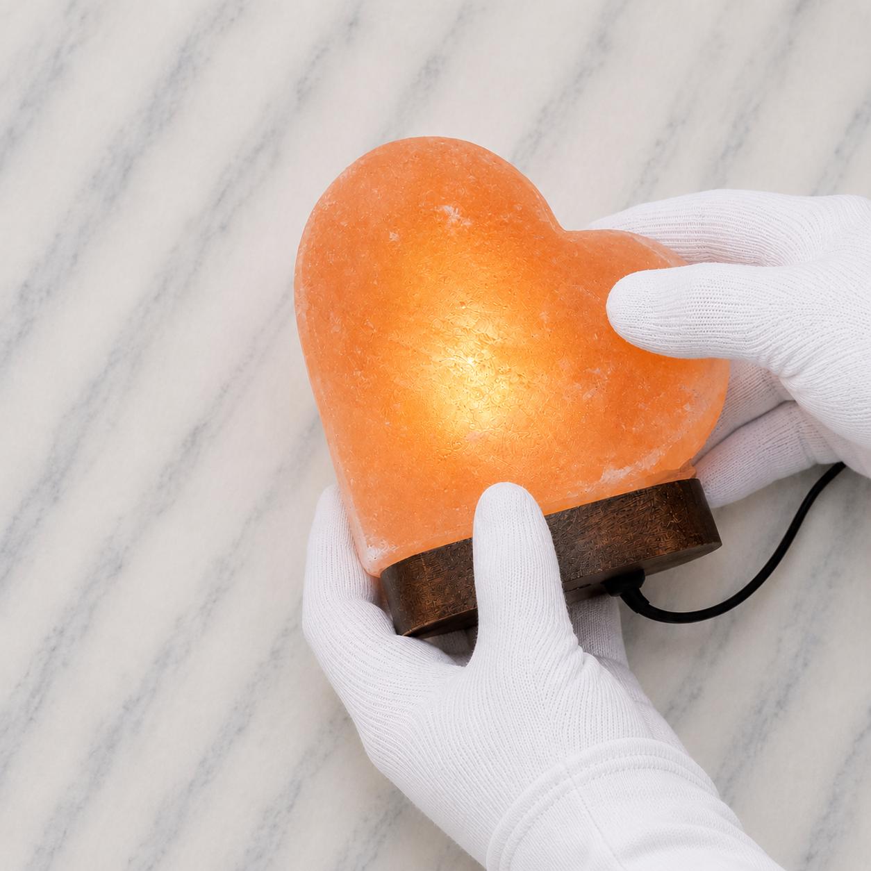 Heart Himalayan Pink Salt Lamp glowing warm pink light in home setting