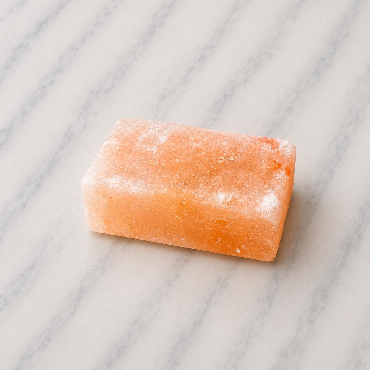 Himalayan Salt Massage Stone Square pink polished surface close up