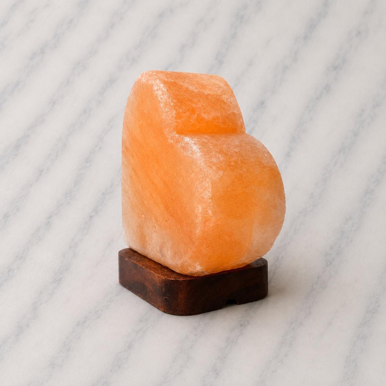 Heart Himalayan Pink Salt Lamp glowing warm pink light in home setting