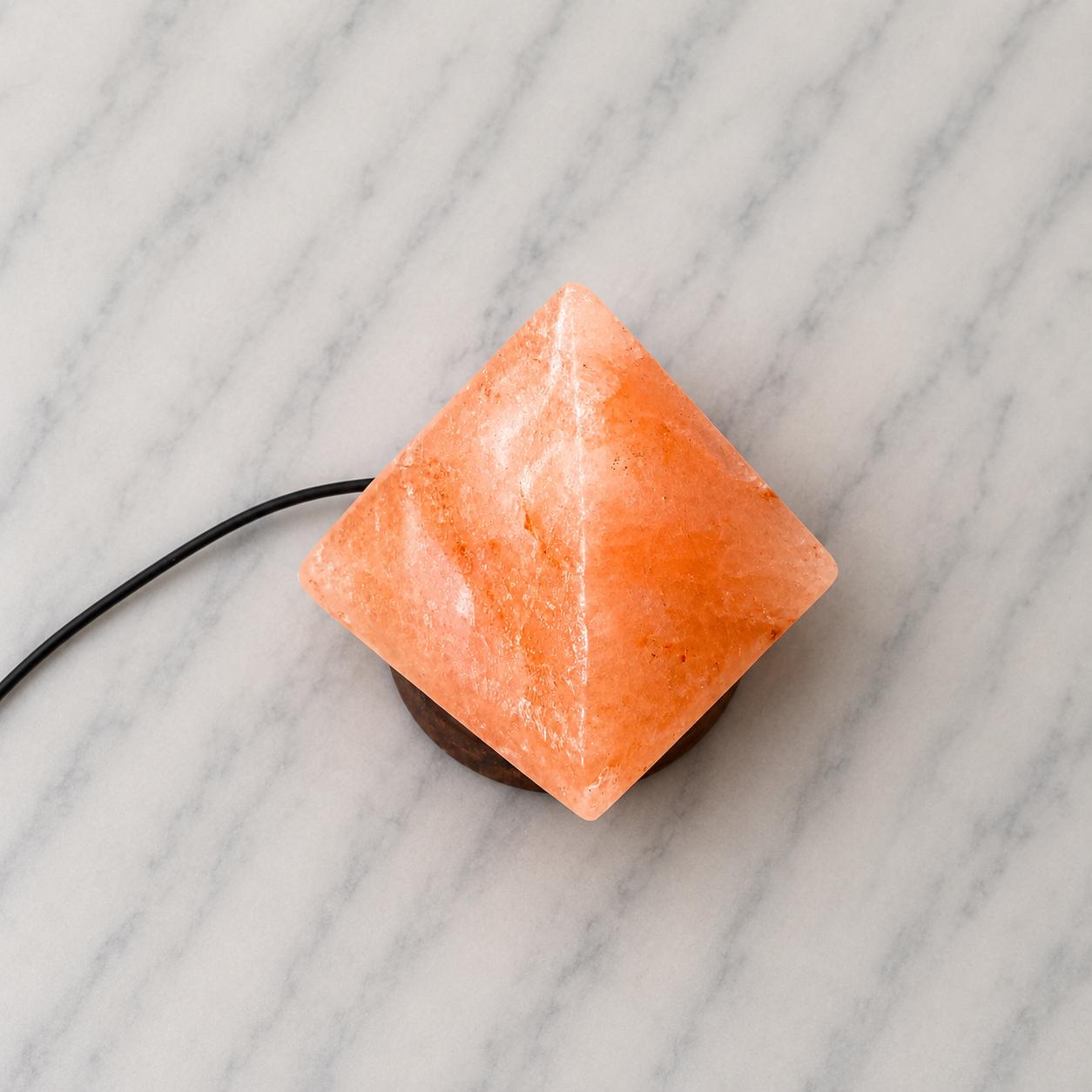 Mini Pyramid Himalayan Salt Lamp USB glowing pink on a desk