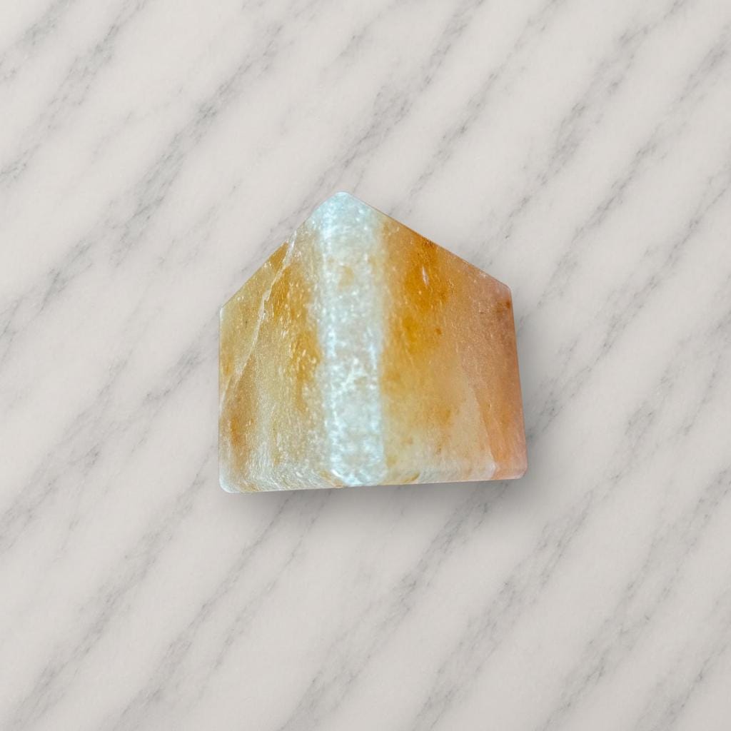 Himalayan Salt Candle Holder Triangle shape glowing with warm candlelight