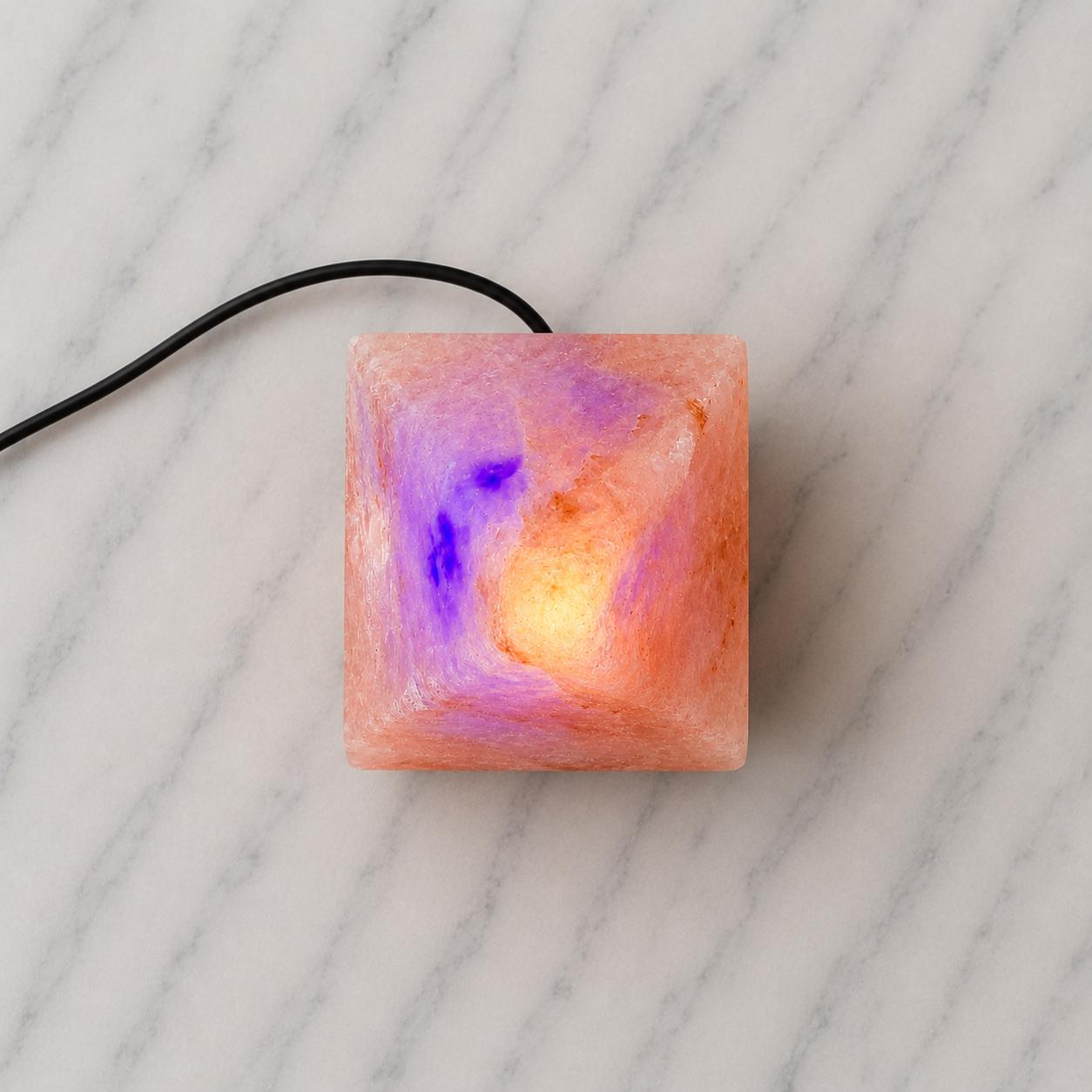 Mini Pyramid Himalayan Salt Lamp USB glowing pink on a desk