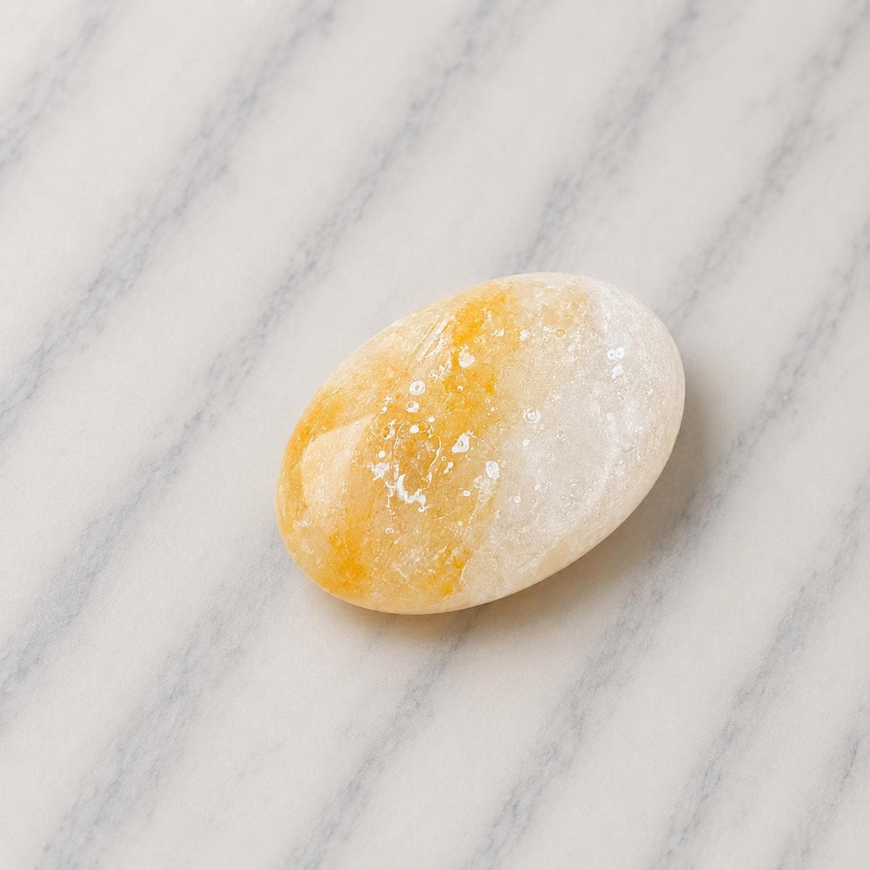 Himalayan Salt Massage Stone Oval smooth pink surface in hand