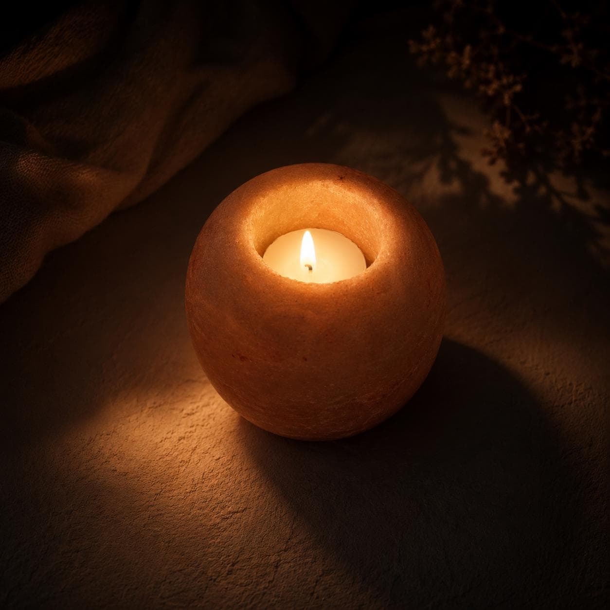 Himalayan Salt Candle Holder Apple shape glowing with warm candlelight