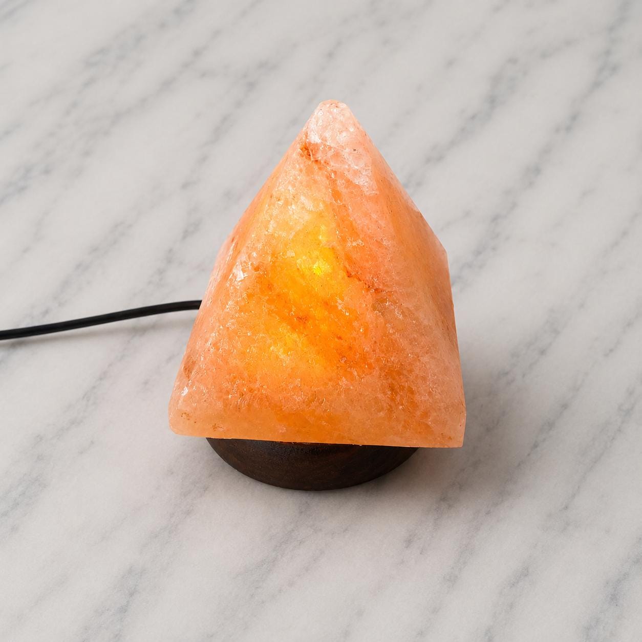 Mini Pyramid Himalayan Salt Lamp USB glowing pink on a desk