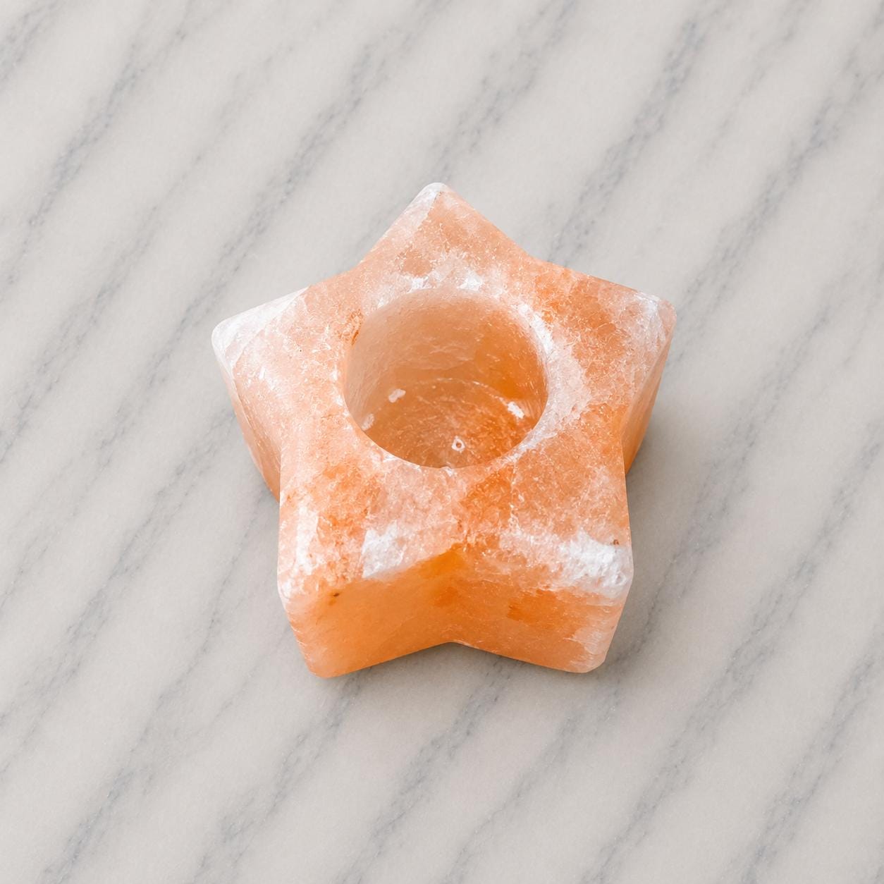 Himalayan Salt Candle Holder Star shape glowing with warm candlelight