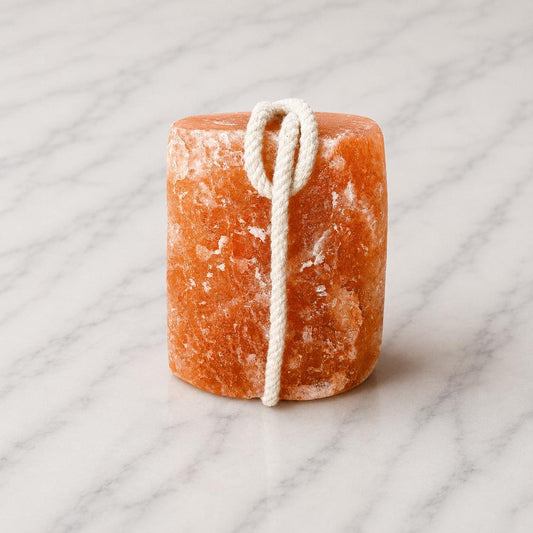 Himalayan Salt Licking Block with rope hanging in a horse stall