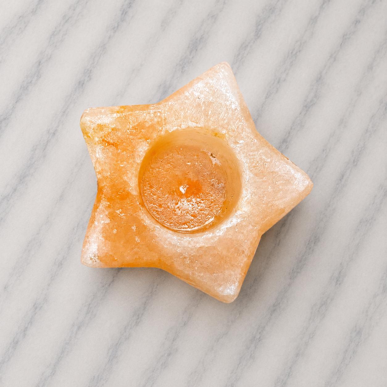 Himalayan Salt Candle Holder Star shape glowing with warm candlelight